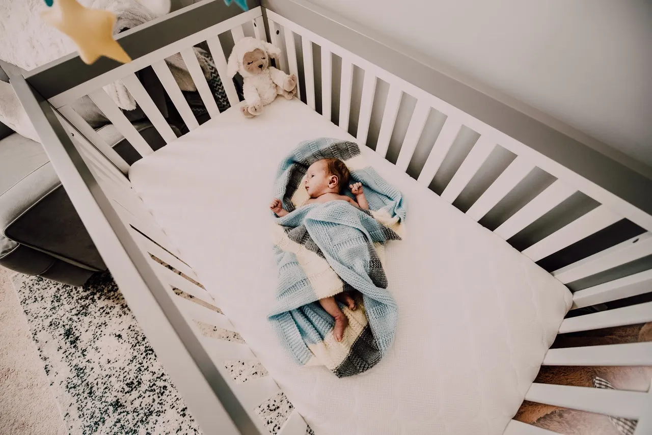 Baby inside a crib