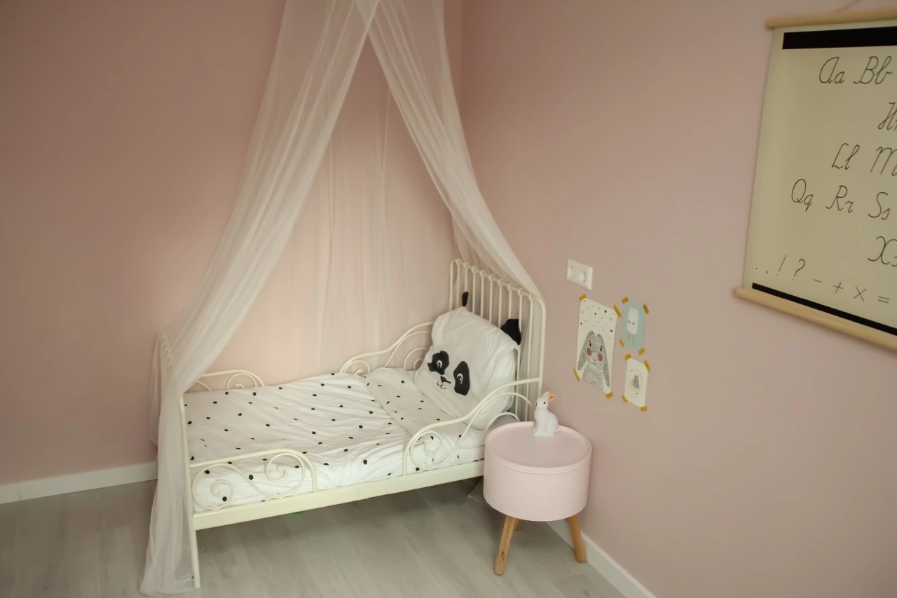 Pink baby room with crib