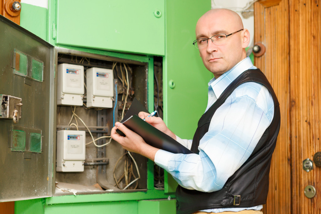 man checking electrical system