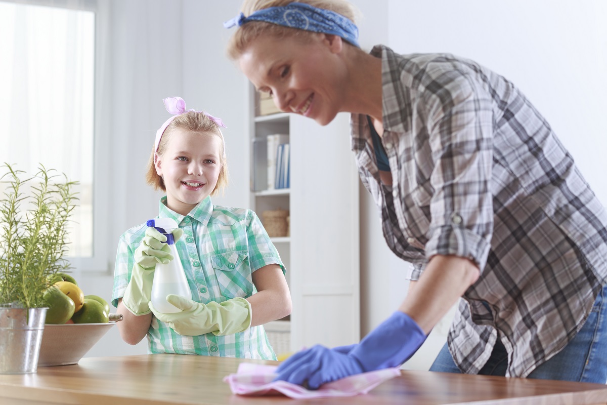 a mom and daughter cleaning together