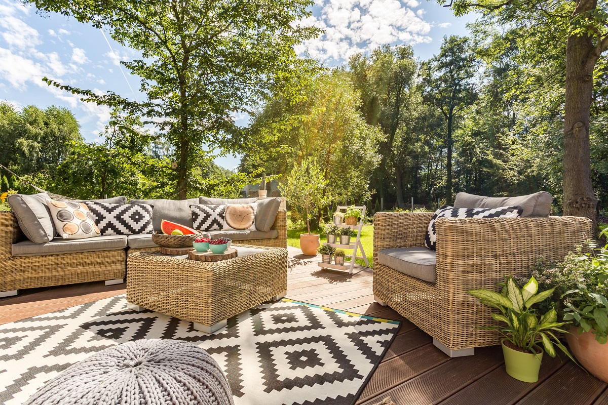sunny outdoor terrace with rattan furniture